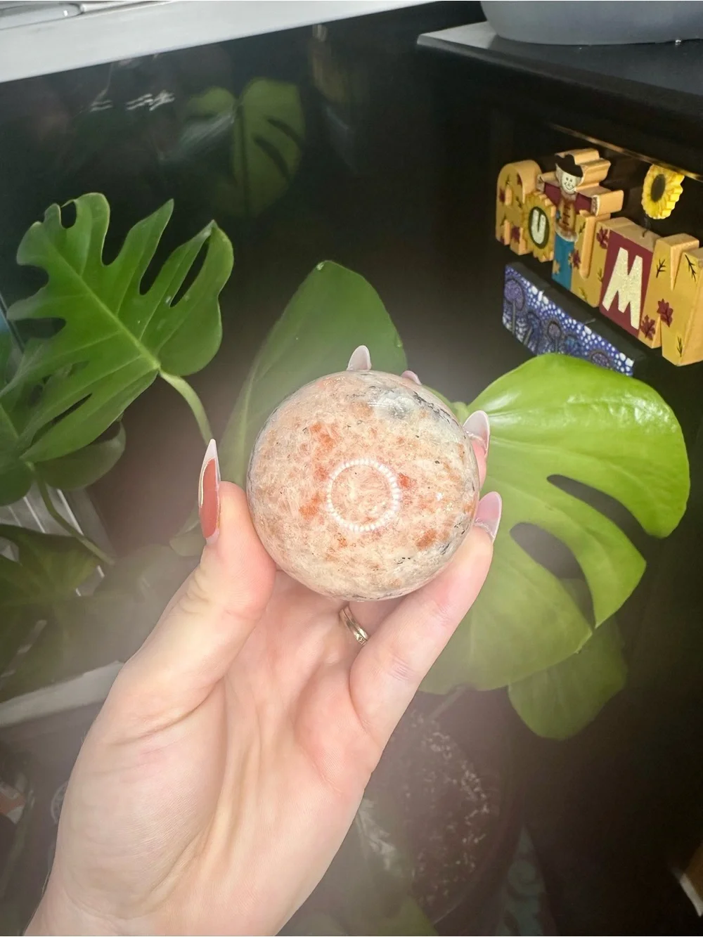 Orange sunstone crystals sphere with banding